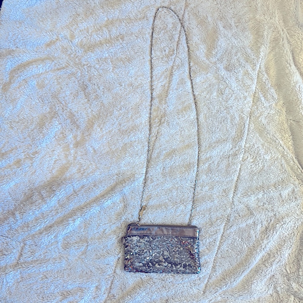 A small over the shoulder hand purse